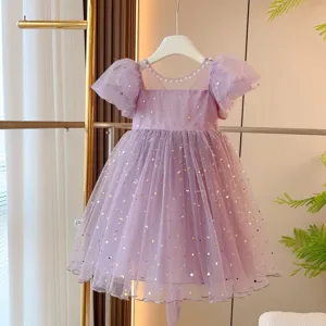 Detailed shot of a lavender puff sleeve tulle dress for girls with gold star sequins