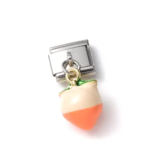 Detailed macro view of a 3D enamel fruit peach charm on a stainless steel link accessory.