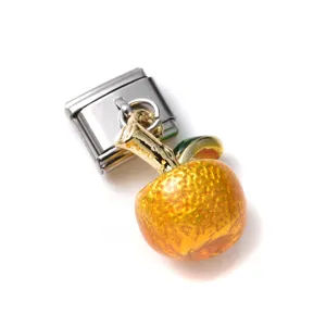 Close-up of a 3D miniature orange fruit charm with detailed texture and silver clasp
