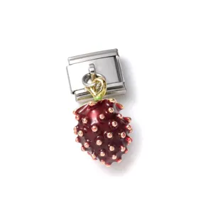 Detail view of a 3D enamel strawberry charm on a stainless steel link for DIY jewelry.