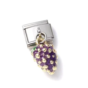 Close-up of a miniature purple grape charm with gold accents attached to a metal link