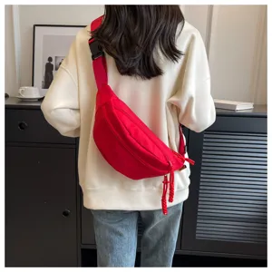 Fashionable red crossbody chest bag for women with wide strap and zipper detail
