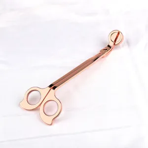 Coupe-mèche en acier inoxydable or rose avec poignée papillon pour bougies.
