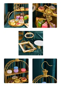 Detailed view of golden iron dessert stands with vintage trays for party decorations.