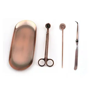 4-piece stainless steel candle tool set with rose gold finish and oval tray