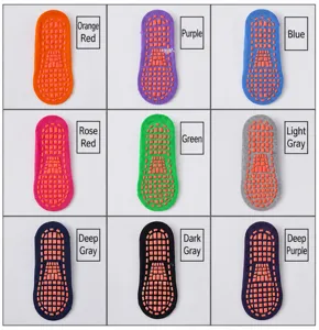 Neun Paar rutschfeste Bodensocken mit Gummisohle in verschiedenen leuchtenden Farben