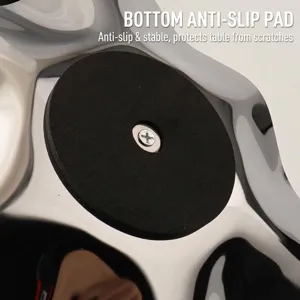 Bottom detail of stainless steel tray with a black non-slip foam pad and secure screw.