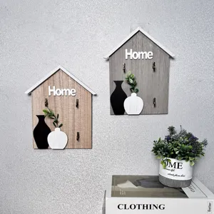Creative wooden house shaped key hooks for wall decor with minimalist vase pattern detail