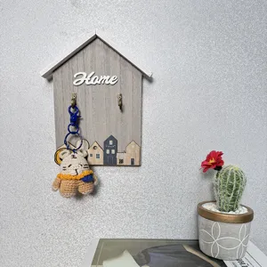 Decorative house-shaped wooden wall hook organizer with Home lettering for key storage