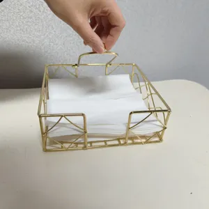 Nordic style gold metal napkin holder for desktop tissue storage in restaurants and homes.