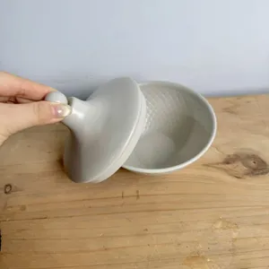 Elegant grey Middle Eastern style snack bowl with lid featuring textured interior detail