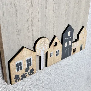 Close-up of Nordic style wooden wall hook featuring creative village house design details