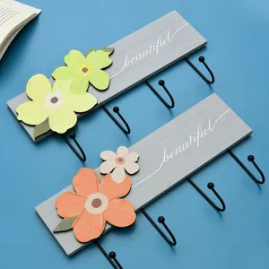 Modern floral wall hooks featuring wood and iron construction for home wall decor