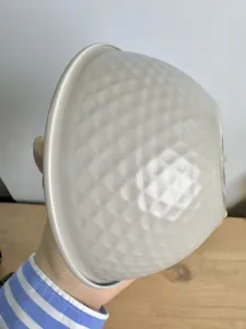 Detailed view of grey textured snack bowl with honeycomb relief pattern
