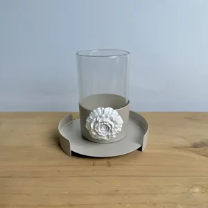Detail view of Arabic style metal cup holder with 3D white flower and glass insert.