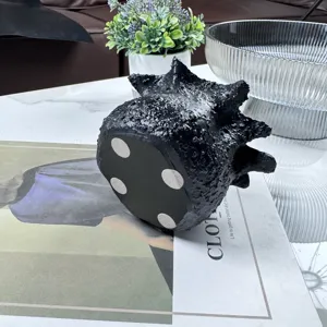 Creative black resin candle cup holder with organic lava texture for modern home decor