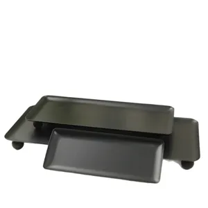Minimalist black rectangular tray set with spherical feet for desktop storage and serving