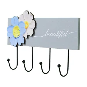 Decorative wooden wall hook featuring blue flowers and 'beautiful' script for entryway