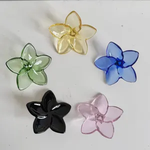 Detailed view of colorful crystal glass flower ornaments in a circular arrangement