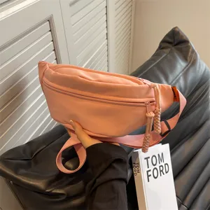 Minimalist pink sports waist bag for women with wide strap and trendy zipper detail