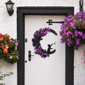 Detailed view of Gothic crescent moon cat wreath with purple flowers on white door