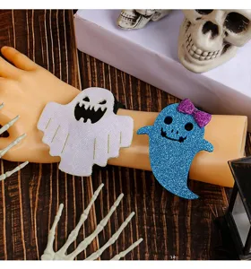 Close-up of glittery Halloween ghost snap bracelets on mannequin hand