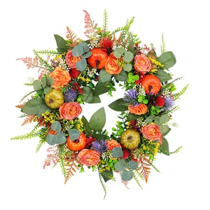 Vibrant autumn pumpkin and rose wreath perfect for Thanksgiving front door decoration.