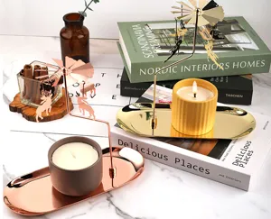 Rotary carousel candle holder with metal tray and scented candle for home decor and cozy ambiance.