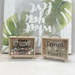 Two Nordic wooden savings boxes featuring Travel Fund and motivational quotes detail view