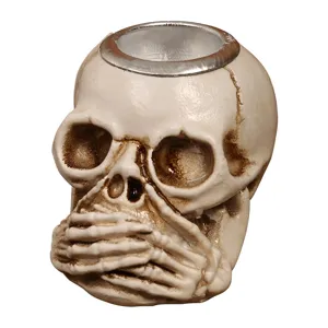 Halloween resin skull ornament with hand-over-mouth design, perfect for spooky tabletop decoration