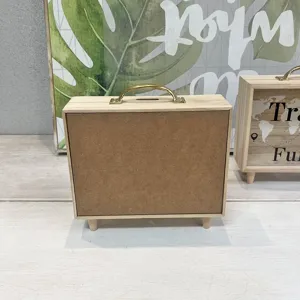 Back view of Nordic wooden suitcase piggy bank with gold handle and sturdy base