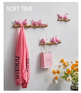 Pink Nordic bird branch wall hooks for stylish home decor and efficient clothing organization