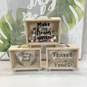 Nordic wooden money boxes featuring Travel Fund and Dream themes for desktop decor