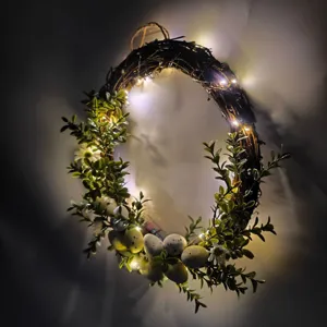 Detailed view of Easter egg wreath with glowing LED lights for spring door decoration