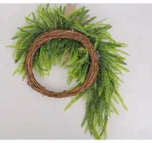 Detailed view of the green fern artificial wreath with natural twig ring and burlap bow