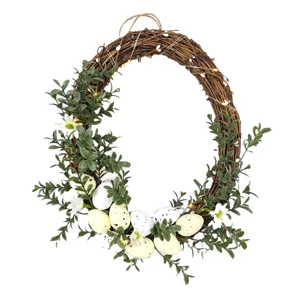 Handmade Easter wreath with artificial speckled eggs, green leaves and LED lights