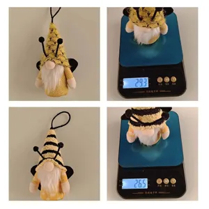 Detailed view of bee-themed gnome plush ornaments showing product weights on digital scale