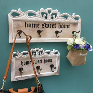 Vintage Wandschmuck-Haken aus geschnitztem Holz mit 'Home Sweet Home' Schriftzug