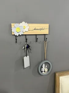 Minimalist wooden wall rack with decorative flowers and four hooks for home storage