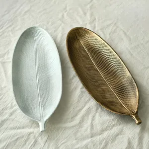 Elegant leaf-shaped wooden decorative trays in gold and silver finish for snacks