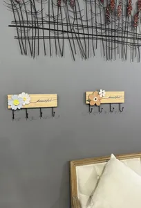 Decorative solid wood wall mounted coat racks with flower accents and black hooks