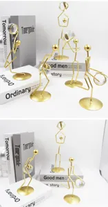 Close-up of golden iron basketball figurines holding crystal balls on decorative books.