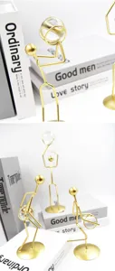 Detailed macro view of golden iron basketball player figurines with crystal ball decor
