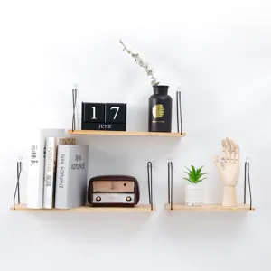 Minimalist set of 3 wall-mounted wooden floating shelves with black metal brackets.