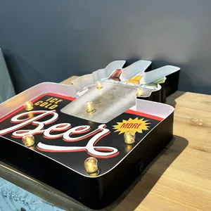 Close-up of industrial LED bar sign with vintage beer design and warm lights