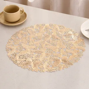 Detailed view of an elegant gold PVC heat resistant placemat with butterfly cutouts