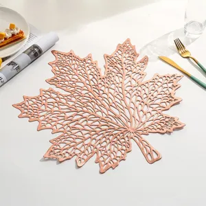 Detailed macro view of an elegant rose gold maple leaf hollow PVC heat resistant placemat