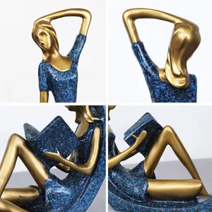 Figurine de fille lisant abstraite en or et bleu pour une décoration de bureau moderne