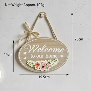 Oval wooden welcome sign with floral design and dimensions: 19.5cm x 14cm