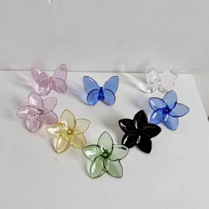 Group of multi-colored crystal butterfly and flower glass ornaments for home decor